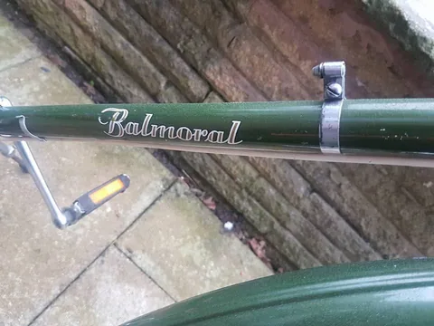 Gold script transfer reading Balmoral on a green top tube