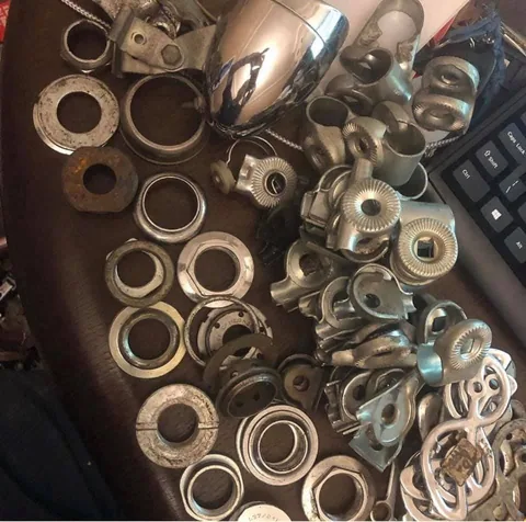 More cups and clamps beside a chrome headlamp