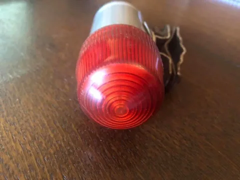 Ribbed red lens of the rear lamp, seen end on