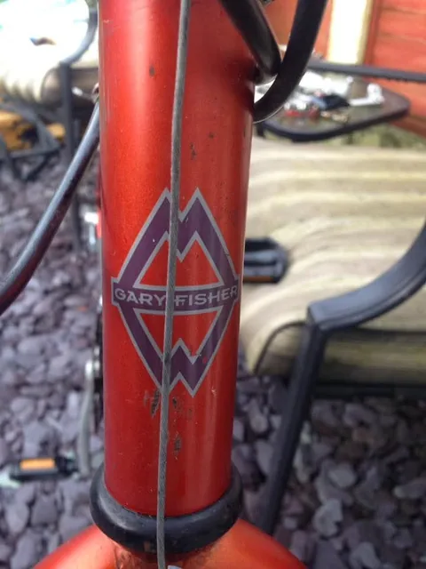 Orange head tube with a diamond-shaped Gary Fisher transfer