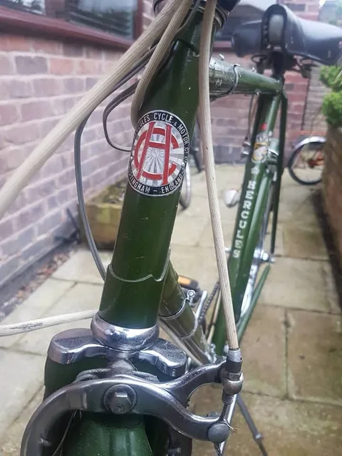 Hercules head badge with a red HC monogram, reading Hercules Cycle and Motor Co, Nottingham, England