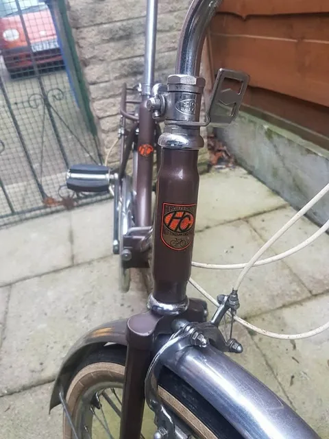 Hercules head badge transfer with an orange HC monogram and a small bicycle drawing, marked Nottingham England