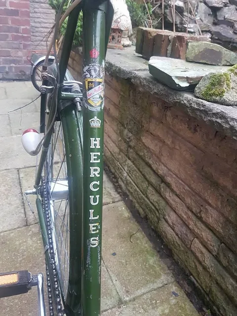 Green seat tube with a dealer's crest, a crown and the name Hercules in gold capitals
