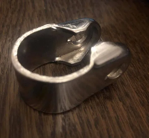 Polished metal clamp with two bolt lugs