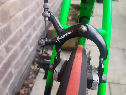 Black Weinmann rear calliper on a green frame