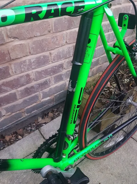 Seat tube with Shimano SIS transfers and a pump, with Reynolds 501 on the chainstay