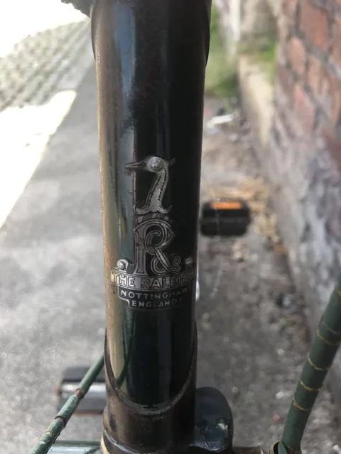 Raleigh heron head badge reading The Raleigh, Nottingham England