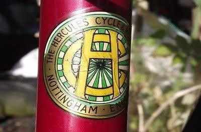 Round transfer with a yellow H on green, reading The Hercules Cycle and Nottingham, England, on a red tube