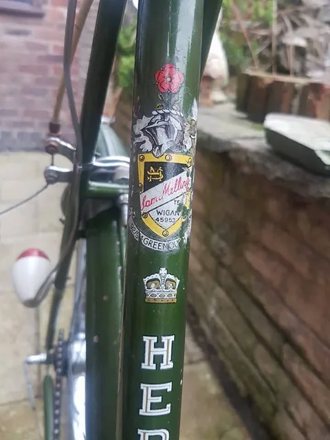 Dealer's transfer with a red rose, a knight's helmet and a shield reading Sam Mellor, Wigan