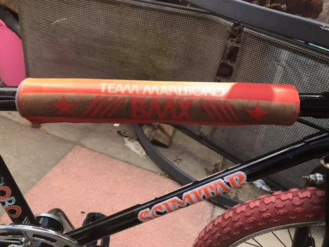 Black top tube with a Scimitar transfer and a padded Team Marlboro BMX cover