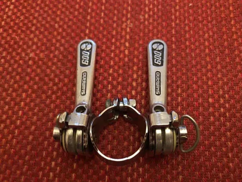 Pair of Shimano 600 gear levers with a clamp band