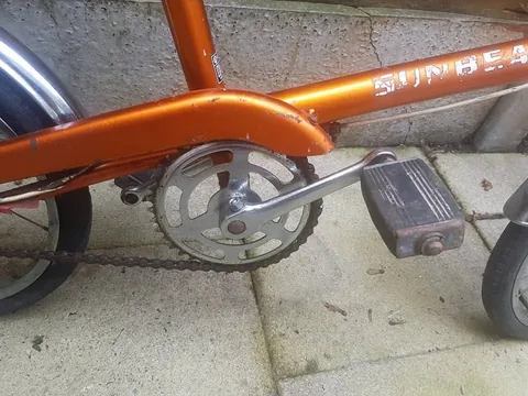 Orange chainguard, steel chainset and rubber-block pedal