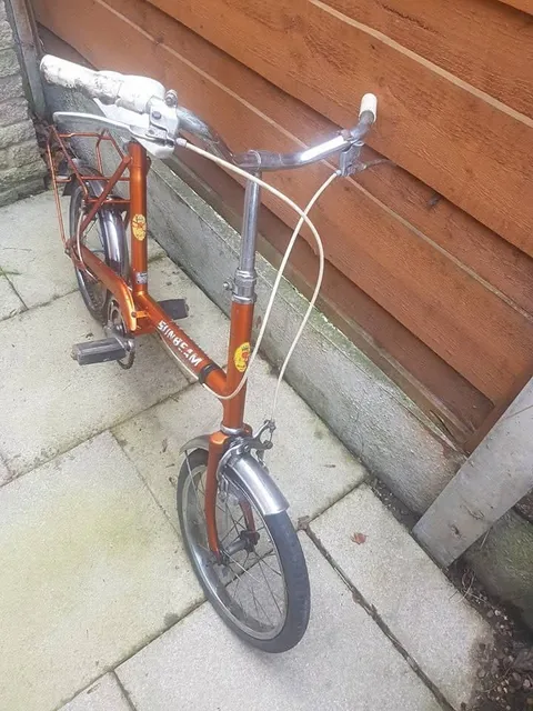 The orange Sunbeam from the front, showing the bars, stem and head transfer