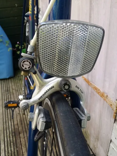 Weinmann front brake marked 570 TOP, with a reflector