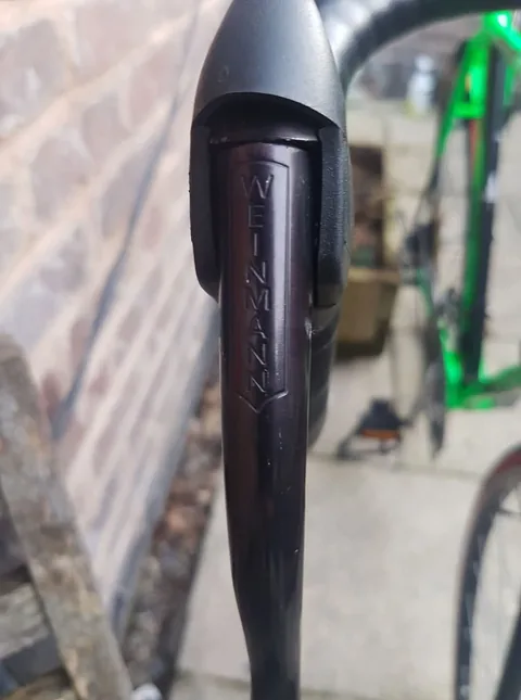 Black brake lever marked Weinmann